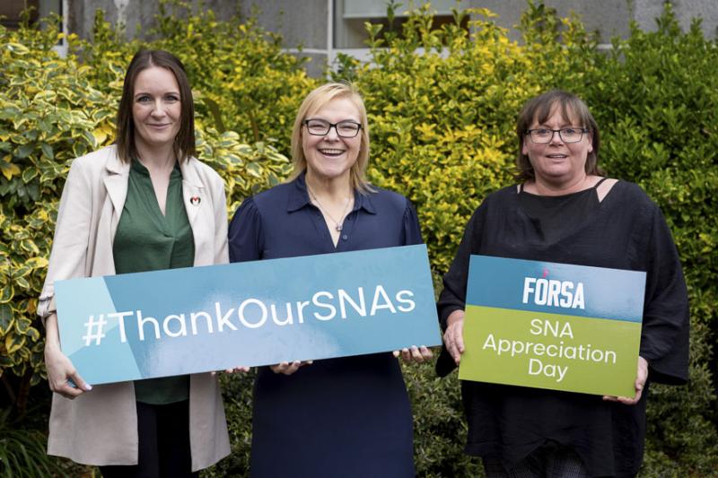 SNA appreciation day photo, of 3 forsa members holding signs for it.